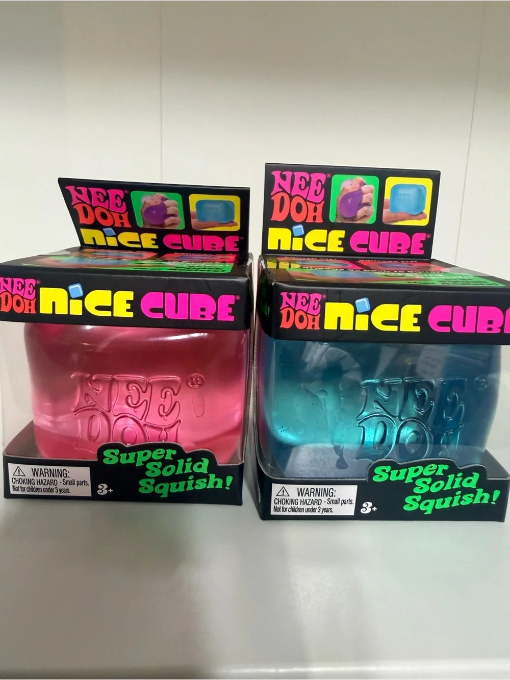 New in Box - 2 pack NeeDoh Nice Cube Squish Toy - Pink & Blue